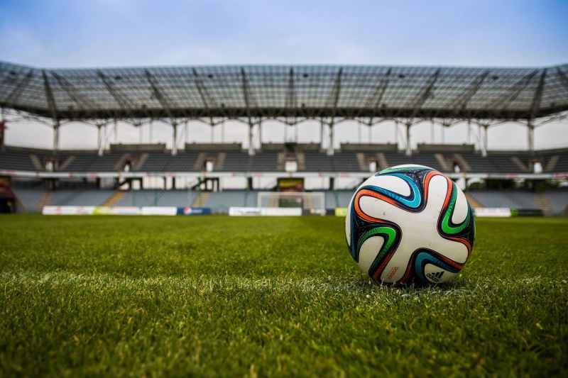 soccer ball on grass field during daytime