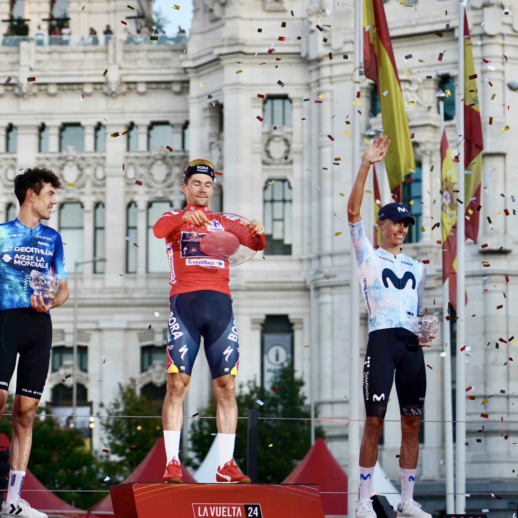 Ben O'Connor, Primoz Roglic and Enric Mas on the podium of La Vuelta 2024.