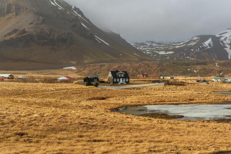 scenic icelandic countryside with black house